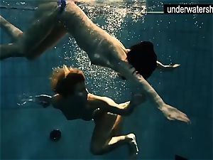 two uber-sexy amateurs showcasing their bods off under water